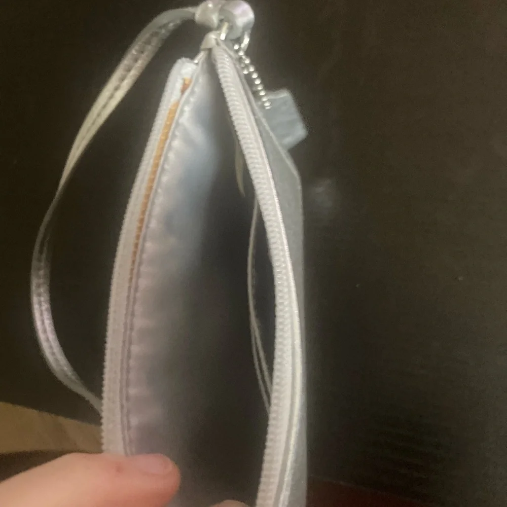 Coach Vintage glittery silver skinny zip wristlet wallet. Good used condition